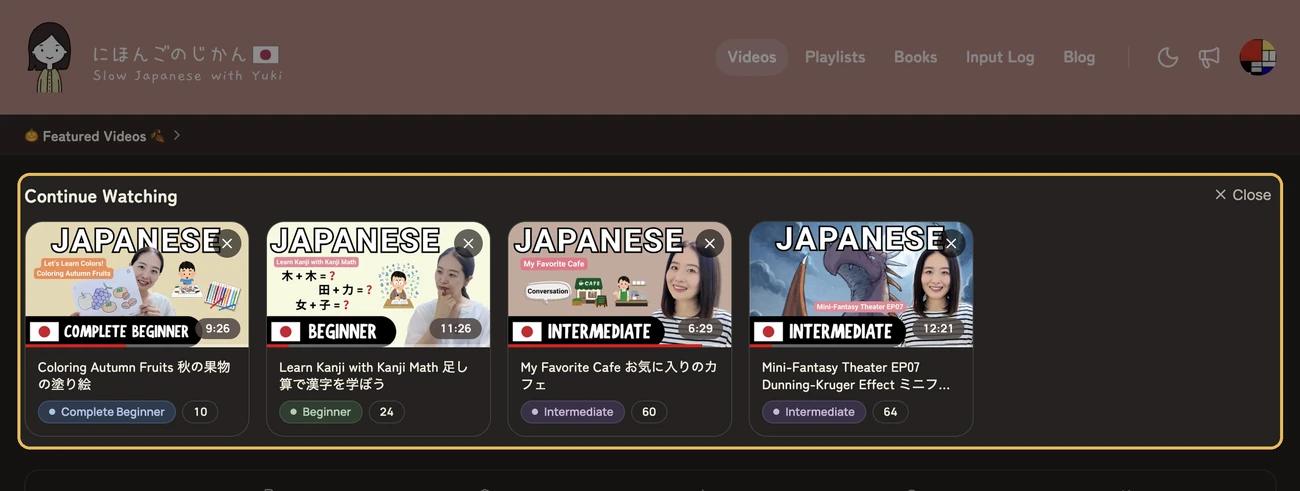 The Videos page with the Continue Watching row highlighted below Featured Videos, showing four videos watched partway
